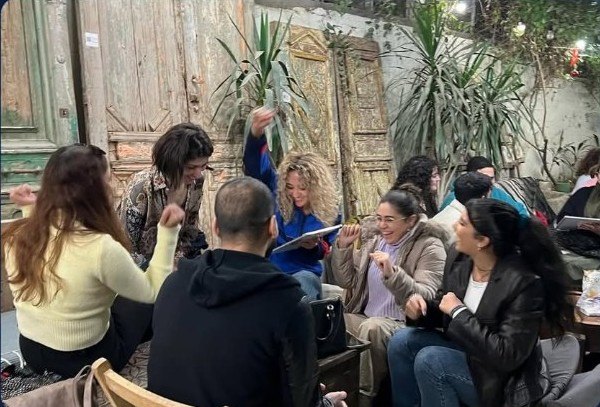 Solo group laughing during a Cairo Trivia Game Night